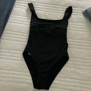 Calvin Klein one piece swimsuit with low back and lace up detailing.